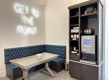 Coffee bar with banquette seating and neon signage
